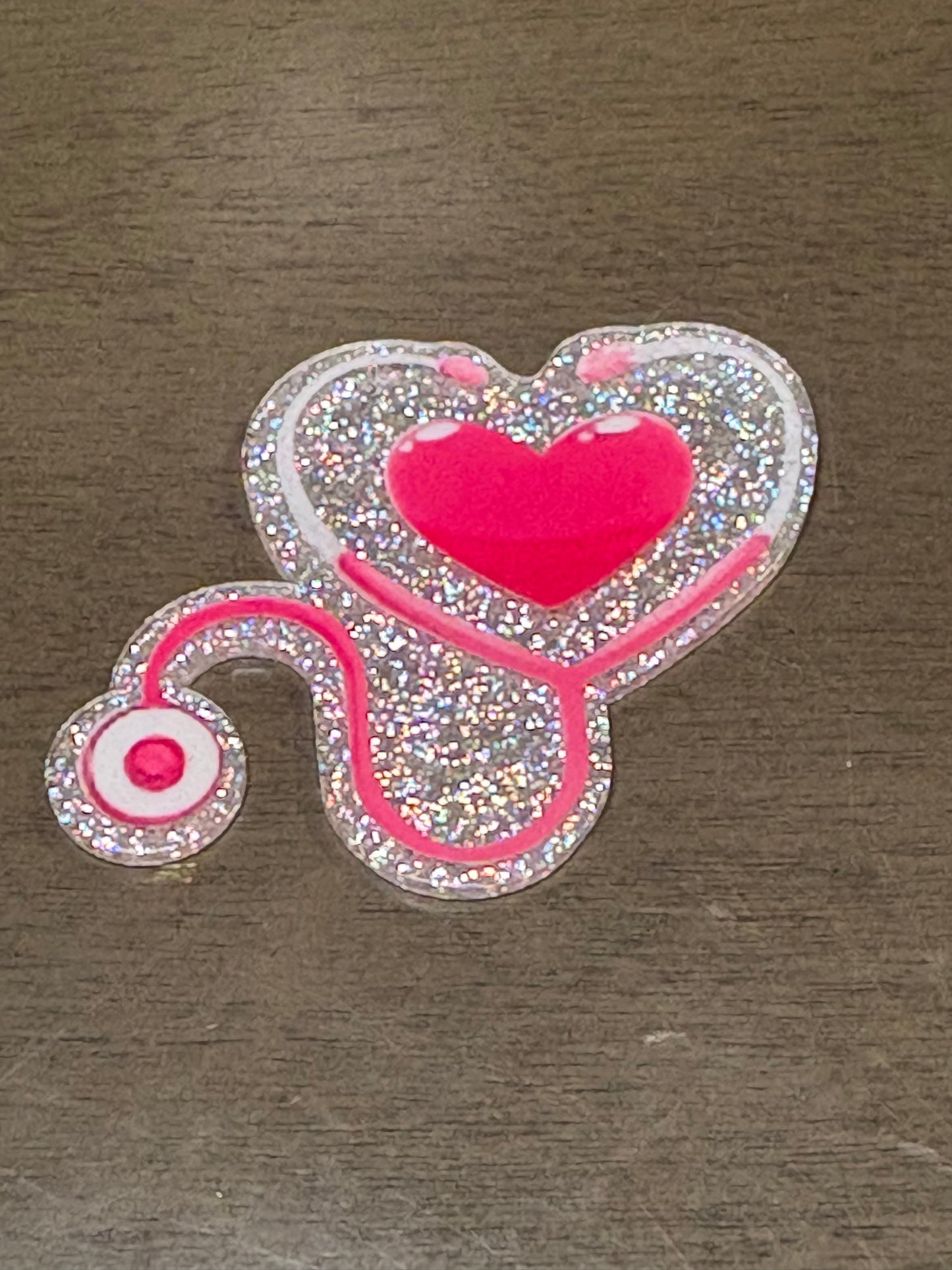 Stethoscope with pink heart badge reel